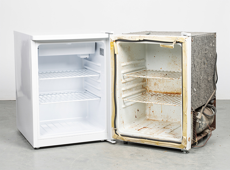Side by side comparison of a new mini fridge versus a worn used fridge showing gasket wear and liner stains