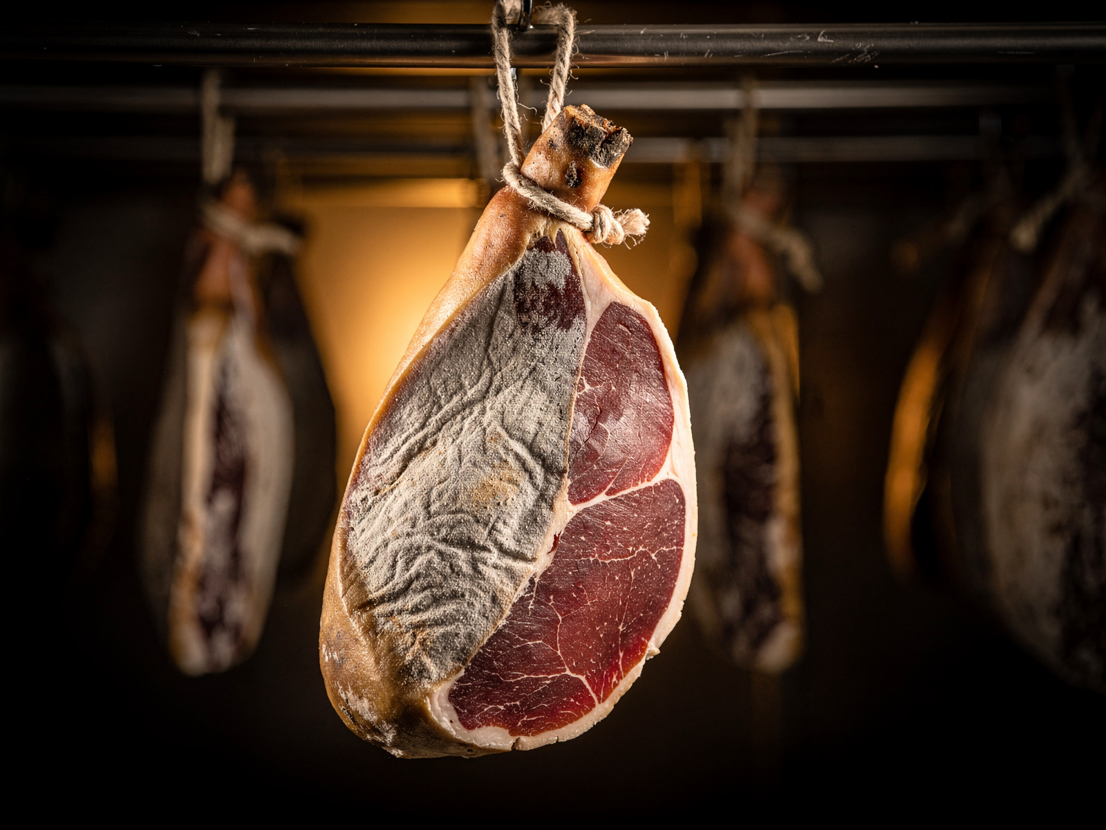 Author examining cured meat